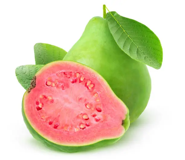 Isolated guava. One and a half pink fleshed guava fruits isolated over white background
