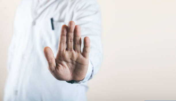 istock doctor shows his hand to stop the virus 1222823166