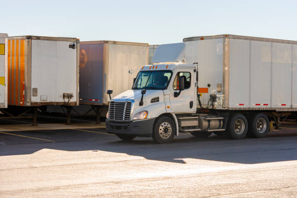 istock Trucking, tractor trailers in a warehouse freight yard. 1222823359