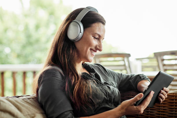 istock Female watching movie at home during lockdown 1222823372