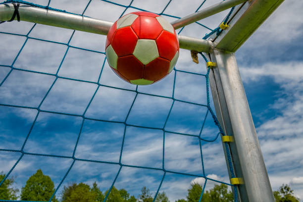 istock soccer ball in goal 1222825619