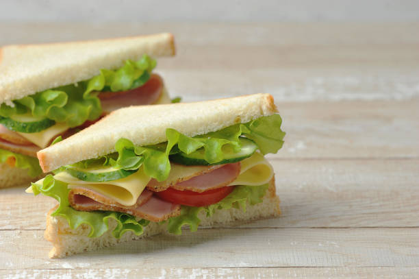 istock Sandwich with ham and cheese made of white bread. Free space for text. 1222827846