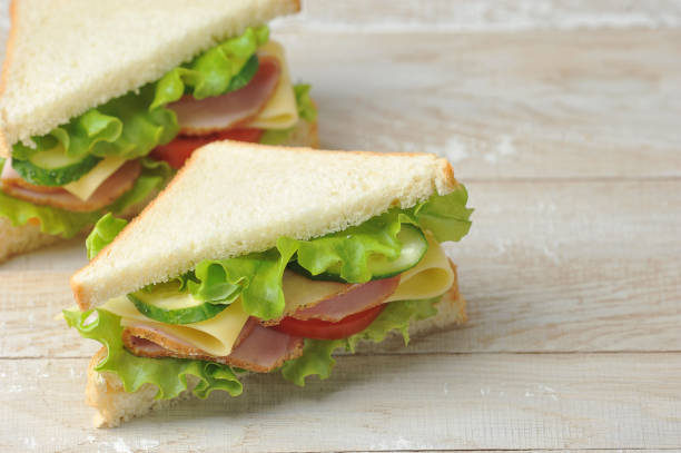 istock Sandwich with ham and cheese made of white bread. Free space for text. 1222827889