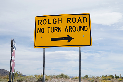 shot of rough road sign