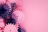 Gear on pink background, minimal teamwork concept