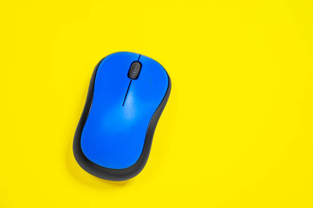 istock The bright blue wireless computer mouse on yellow background. Isolated, studio, indoors, top view. Copy space for any text or design work. 1222828788