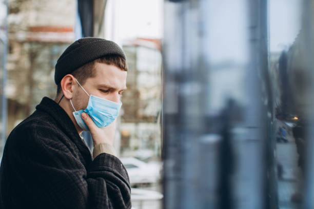 istock Man in the street wearing protective mask. 1222831495
