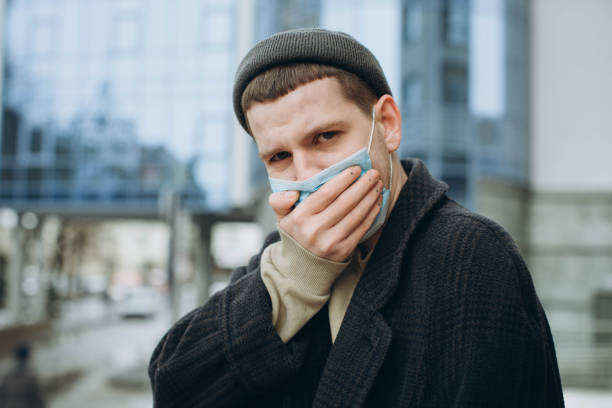 istock Man in the street wearing protective mask. 1222831578