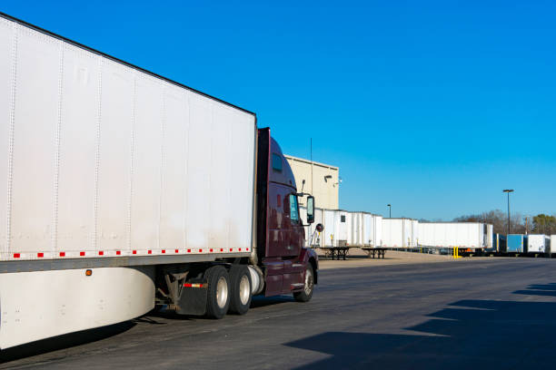 istock Trucking, tractor trailers in a warehouse freight yard. 1222832876