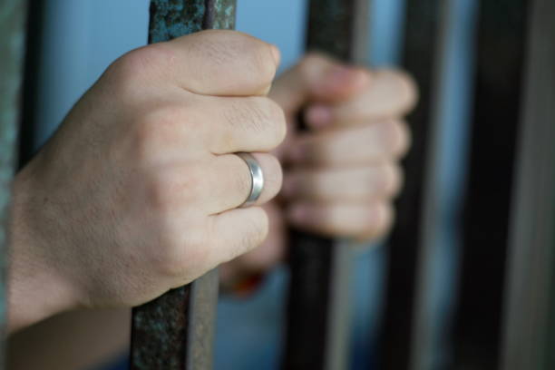 istock prisoner in police station 1222833279