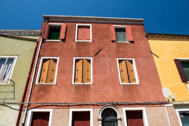Facade of houses in Murano, a series of islands linked by bridges in the Venetian  lagoon in northern Italy, famous for its glass-making industry.