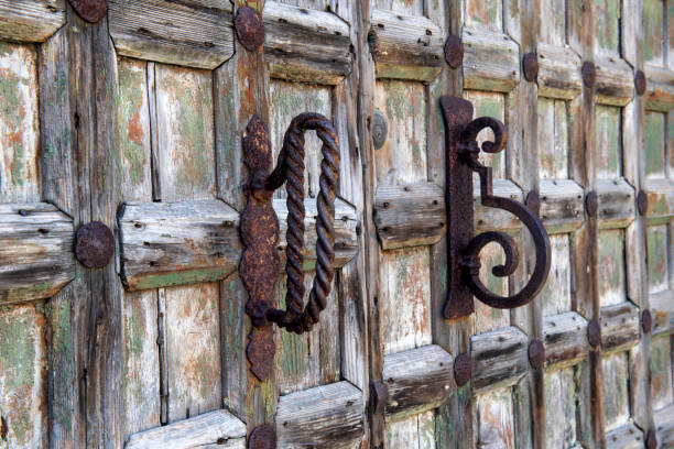 Weathered door in Murano, a series of islands linked by bridges in the Venetian  lagoon in northern Italy, famous for its glass-making industry.