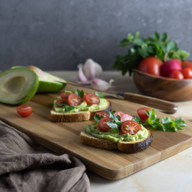 istock Sandwiches with cherry tomato and avocado sauce 1222834817