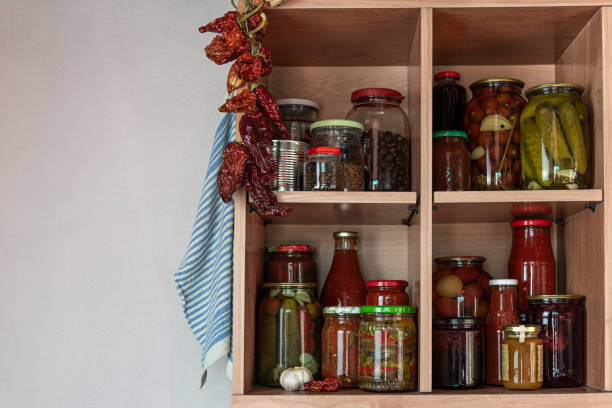 istock Homemade vegetables in cans on shelves 1222836635