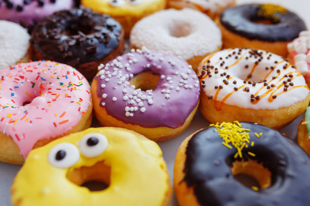 istock A lot of multi-colored donuts with different fillings, top view 1222837664