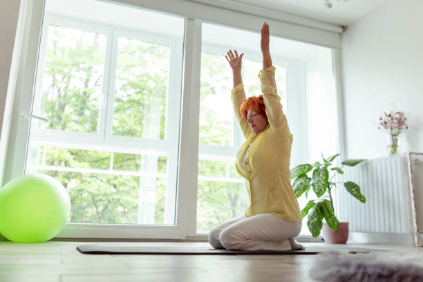 istock Senior woman doing yoga practice 1222839416