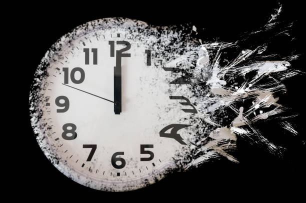 istock Time is running out concept shows clock that is dissolving away into little particles. Black and white wall clock 1222840517
