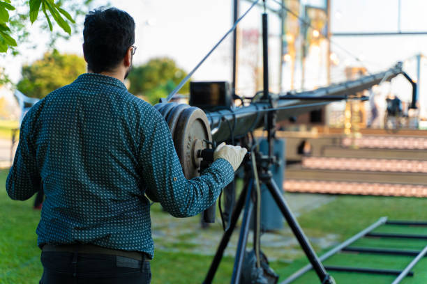 cameraman working in a broadcast television virtual outdoors tv studio. - filmando com guindaste imagens e fotografias de stock