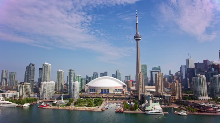 AERIAL CN Tower in Downtown Toronto, Ontario in sunshine