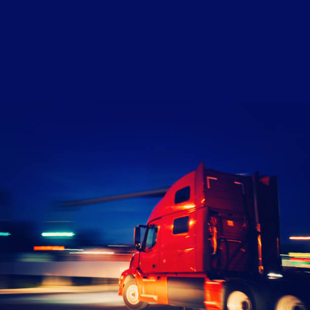 istock Red Semi truck tractor turning on a road 1222842842