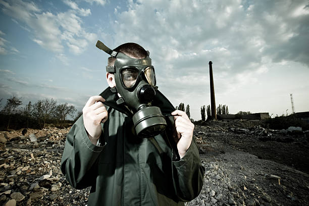 istock man wearing gas masks after nuclear disaster 122284463