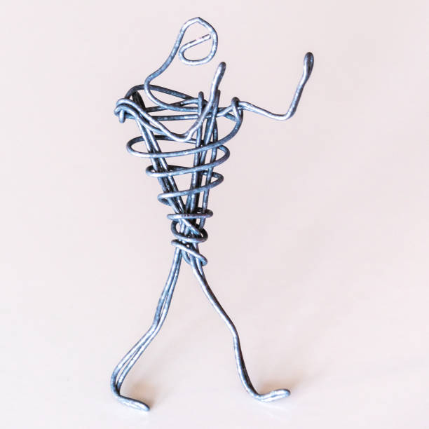 istock A man of wire stands in a boxing stance, symbolizing the struggle against difficulties, determination, activity 1222846914
