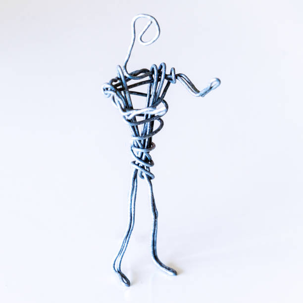 istock A man of wire stands gesturing with his hands, symbolizing conversation, proof 1222846975