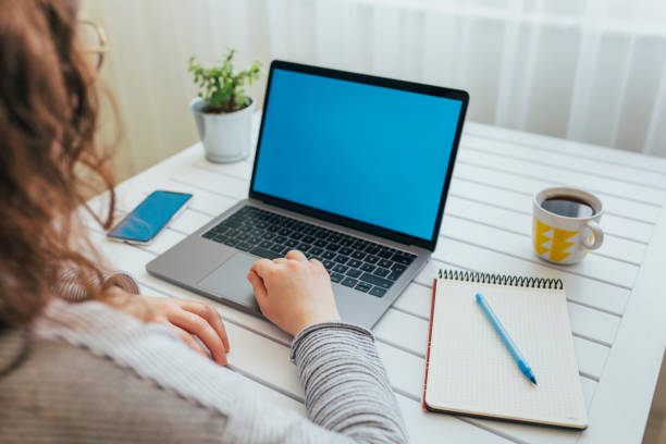 istock Young woman using laptop with blank screen 1222847423
