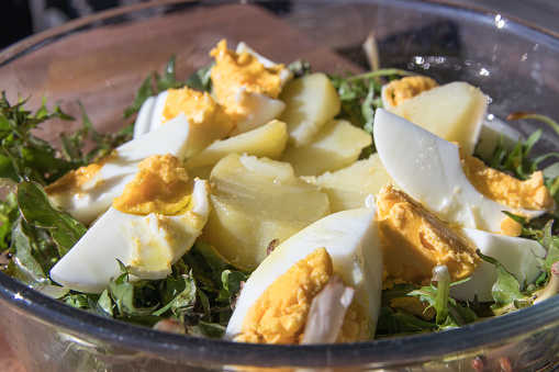 Dandelion salad with eggs and potatoes