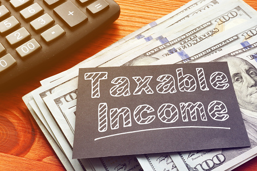 Taxable Income is shown on the conceptual business photo
