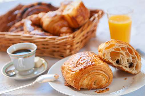 Coffee, orange juice and some french pastries