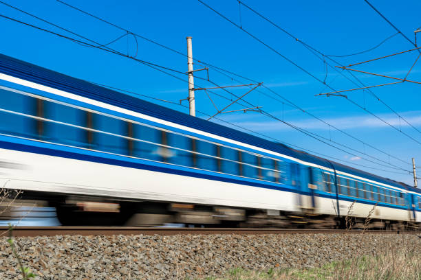 istock wagons of an express train passing along the tracks 1222852277