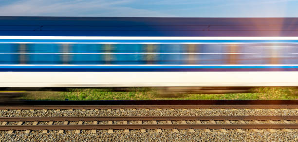 istock wagons of an express train passing along the tracks 1222852465