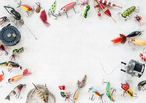 Vintage Fishing Lures on an Old Wood Background