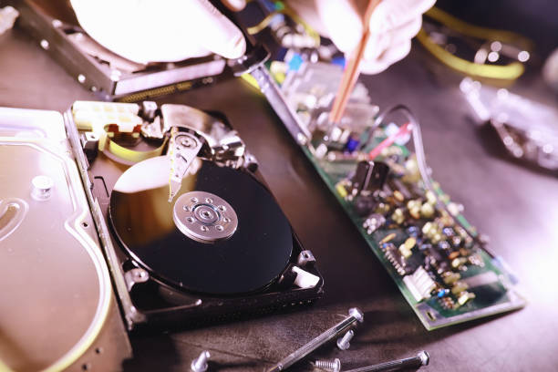 istock Computer equipment. Repair of PC components. Hard drive for restoration in the workshop. Winchester virus recovery. 1222853378