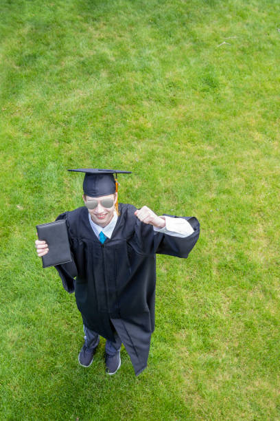istock Happy Graduate Outdoors Holding Diploma 1222854049