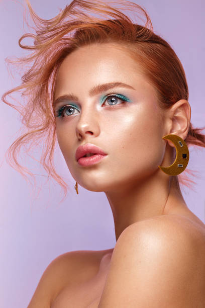 beautiful girl with unusual accessories and make-up on a bright background. beauty face. - bangs fashion model women elegance imagens e fotografias de stock