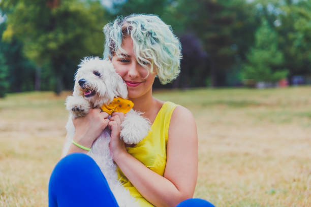 istock Young woman enjoying with her dog 1222855541