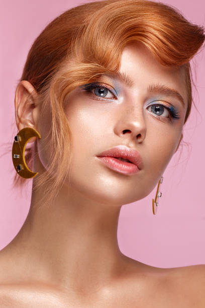 beautiful girl with unusual accessories and make-up on a bright background. beauty face. - bangs fashion model women elegance imagens e fotografias de stock