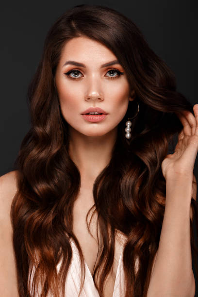 istock woman with curls and make-up. 1222856589