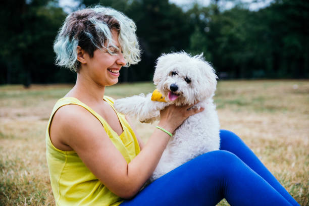 istock Young woman and her white dog 1222856749