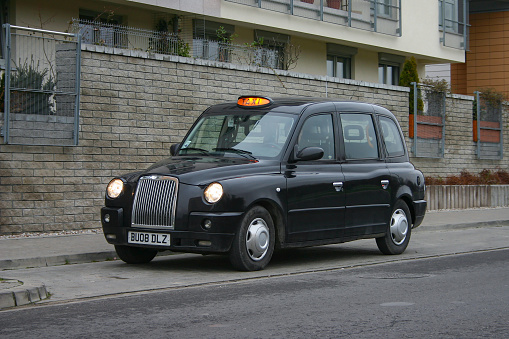 Warsaw, Poland – 11 December, 2009: LTI TX4 (London Taxi Company) taxi stopped on a parking. This vehicle is equipped in special wheelchair ramp on the right side of the car. The LTI TX4 was the most popular taxi vehicle in UK.