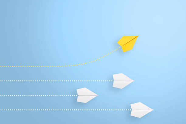 istock Change concepts with yellow paper airplane leading among white 1222858321
