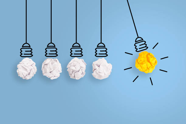 istock Creative Idea Concepts with Light Bulb Crumpled Paper on Blue Background 1222858494