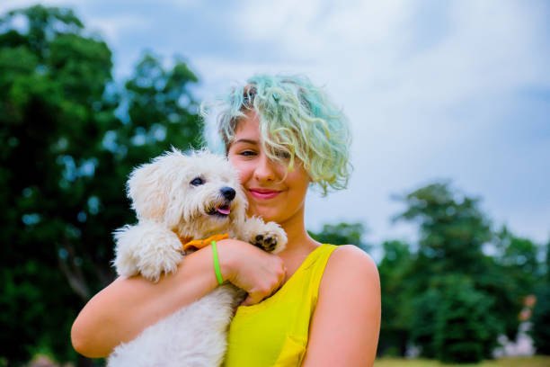 istock Girl with a puppy in her hands 1222858640