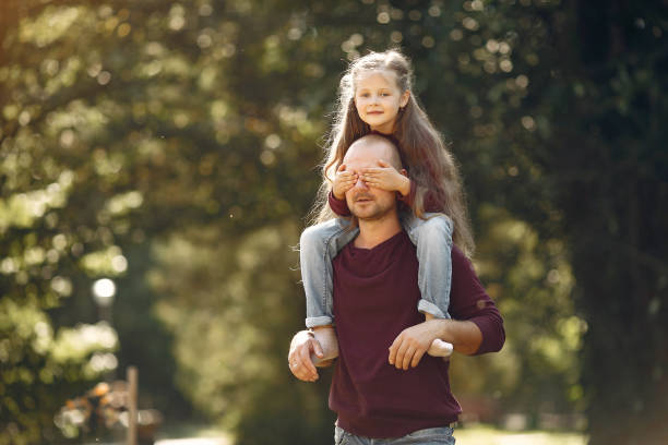 istock Cute family playing in a autumn park 1222858853