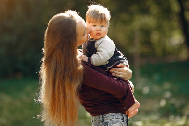 istock Mother with daughter playing in a summer park 1222858923