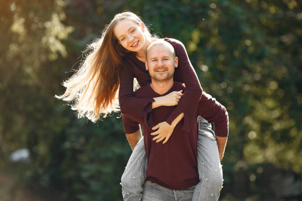 istock Beautiful couple spend time in a autumn park 1222859544