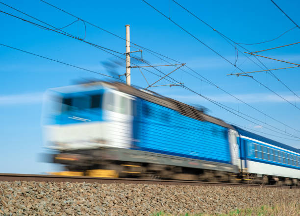 istock Blue train powered by electricity, drives through the countryside. Blurred 1222860152