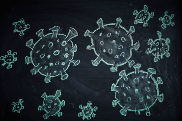 istock Outbreak Warning. written white chalk on blackboard in connection with epidemic of coronavirus worldwide. 1222860431